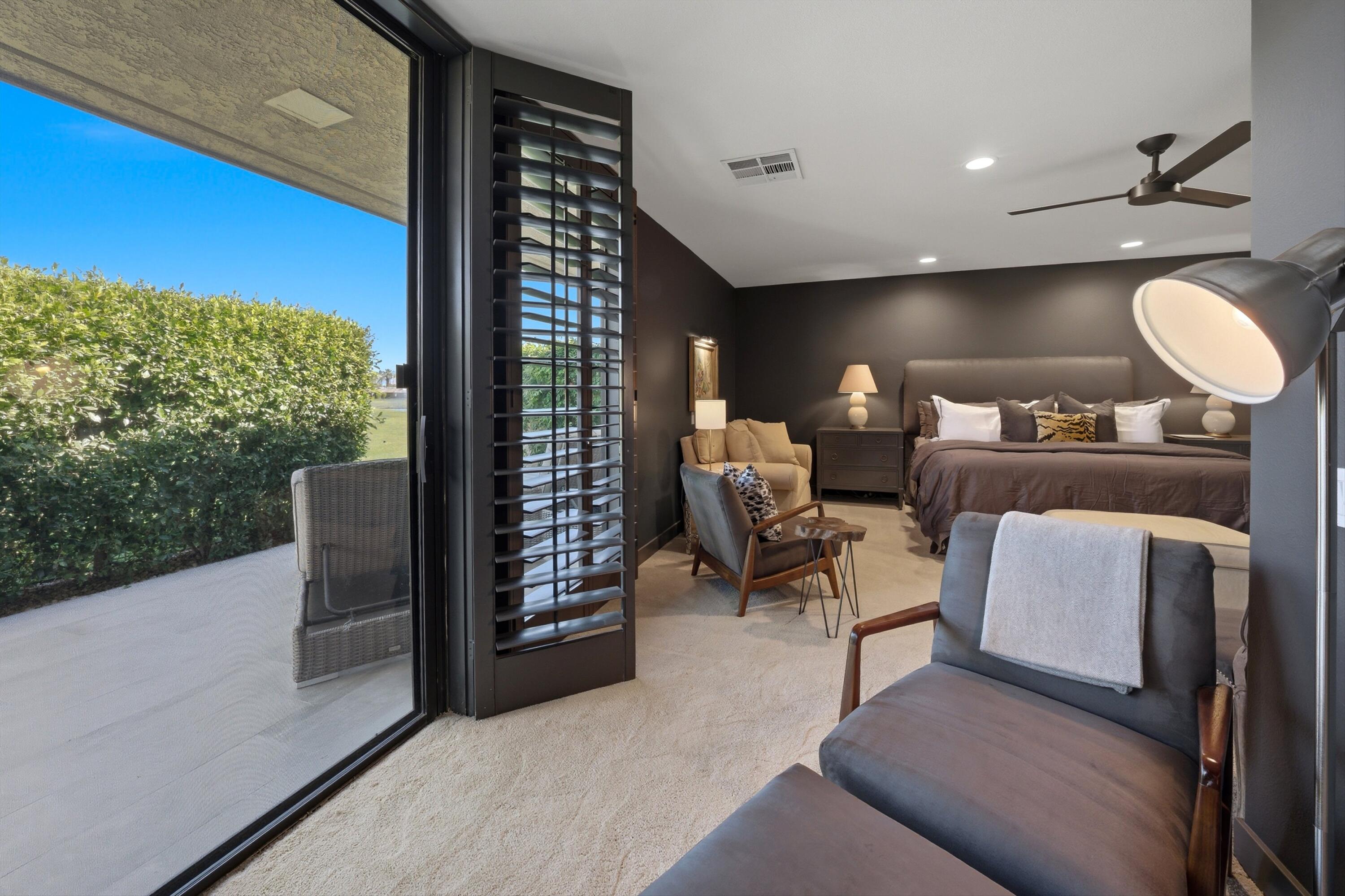 3 Barnard Court Rancho Mirage, CA 92270 - Photo 22 of 47 a living room with furniture and a large window