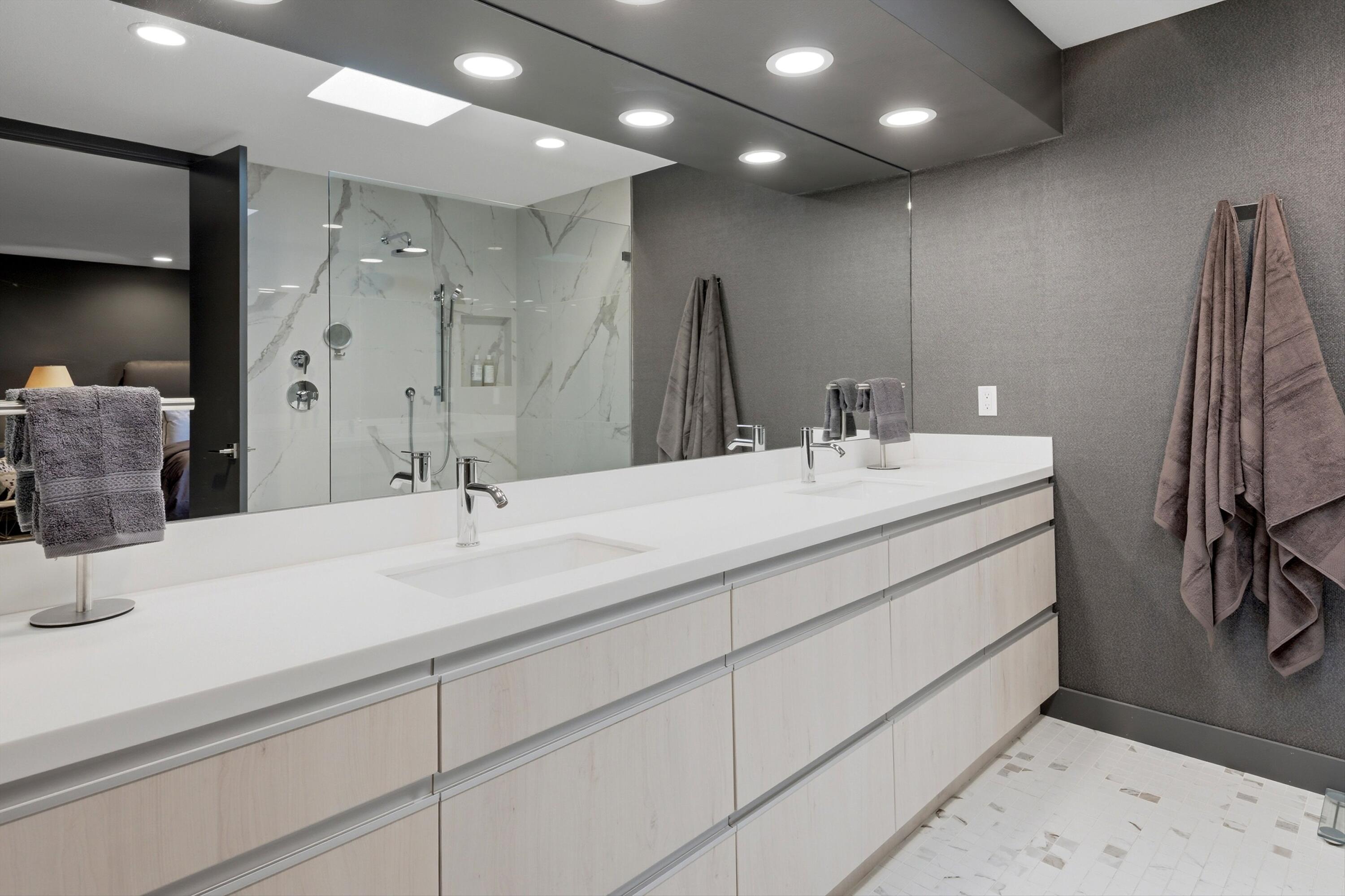 3 Barnard Court Rancho Mirage, CA 92270 - Photo 23 of 47 a bathroom with a double vanity sink mirror and shower