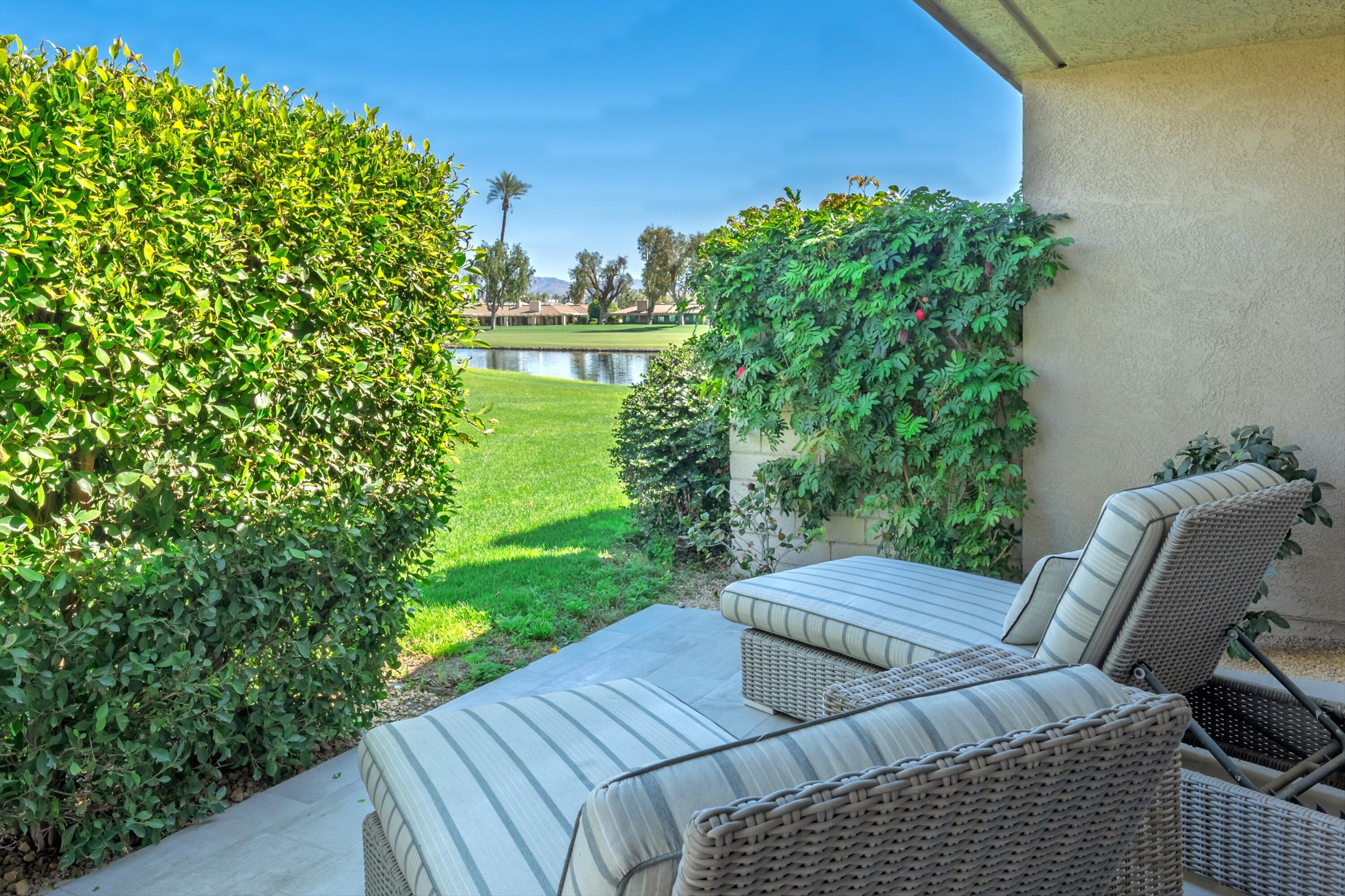 3 Barnard Court Rancho Mirage, CA 92270 - Photo 25 of 47 a view of a backyard with sitting area