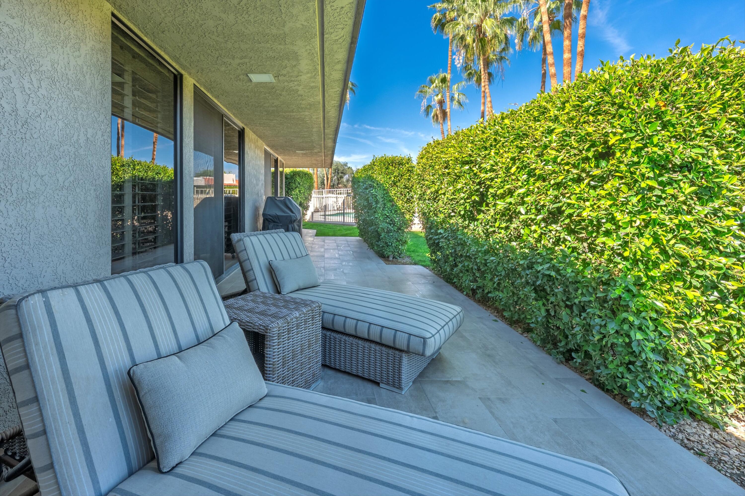 3 Barnard Court Rancho Mirage, CA 92270 - Photo 26 of 47 a view of balcony with outdoor seating and plants
