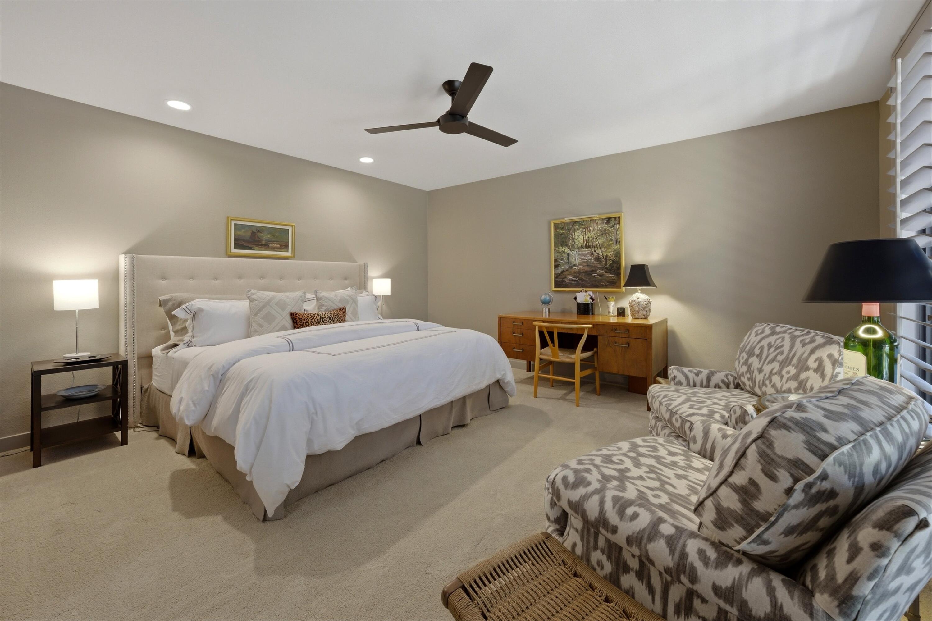 3 Barnard Court Rancho Mirage, CA 92270 - Photo 28 of 47 a bedroom with a bed and a lamp