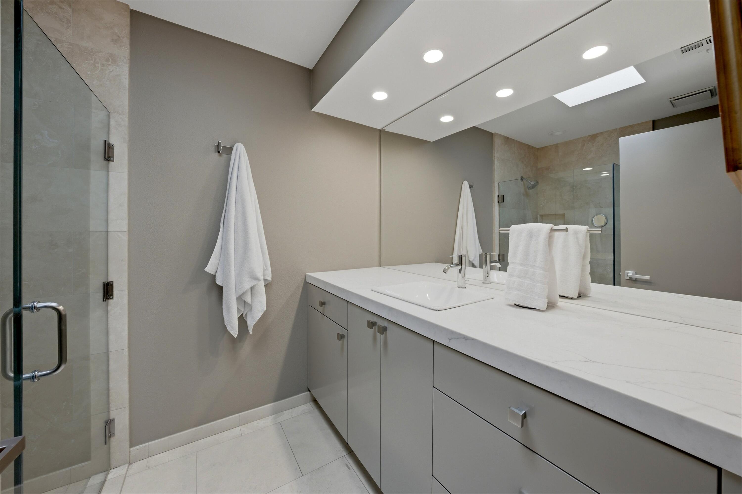 3 Barnard Court Rancho Mirage, CA 92270 - Photo 29 of 47 a bathroom with a sink and mirror
