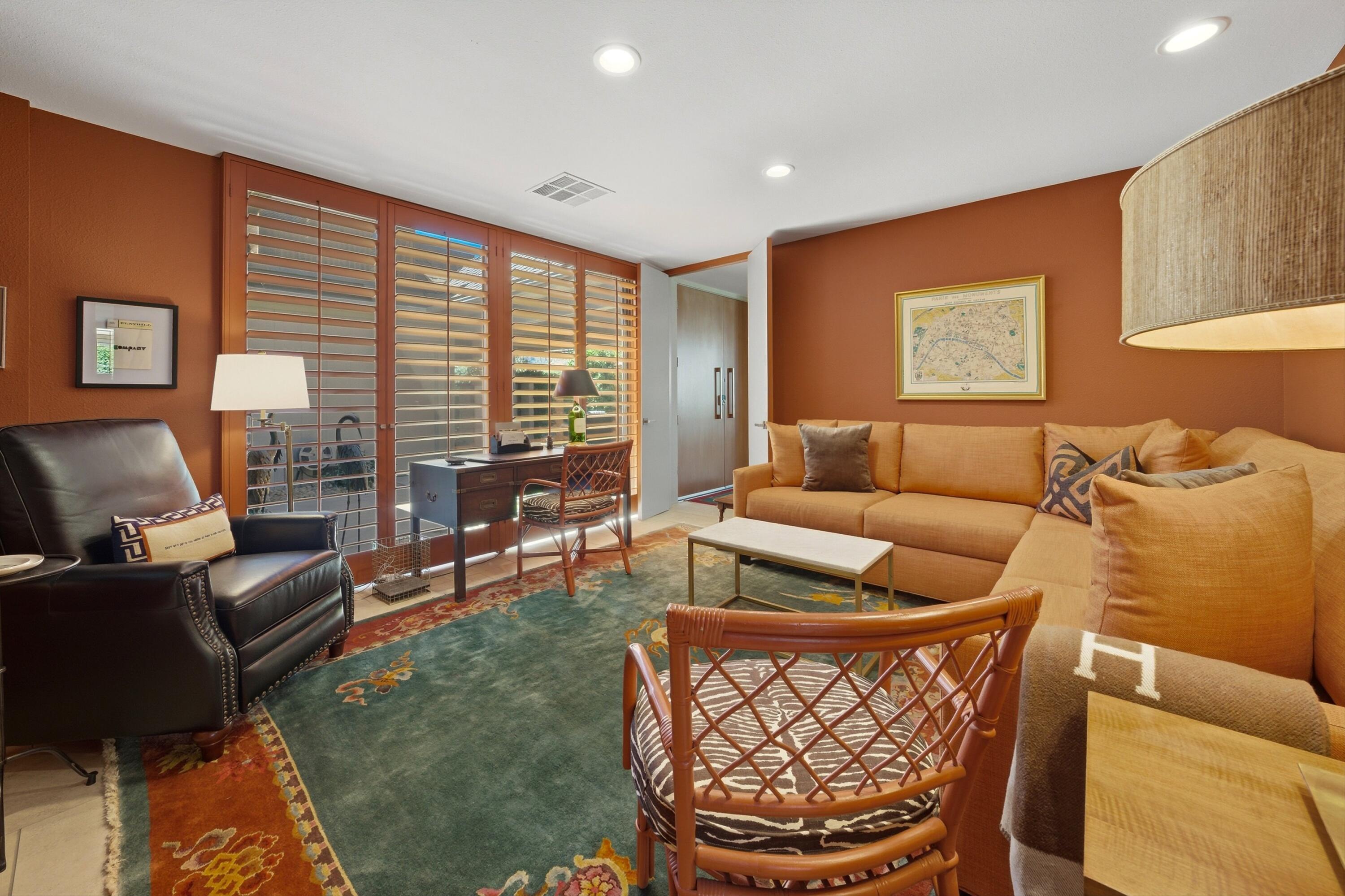 3 Barnard Court Rancho Mirage, CA 92270 - Photo 30 of 47 a living room with furniture a rug and a window