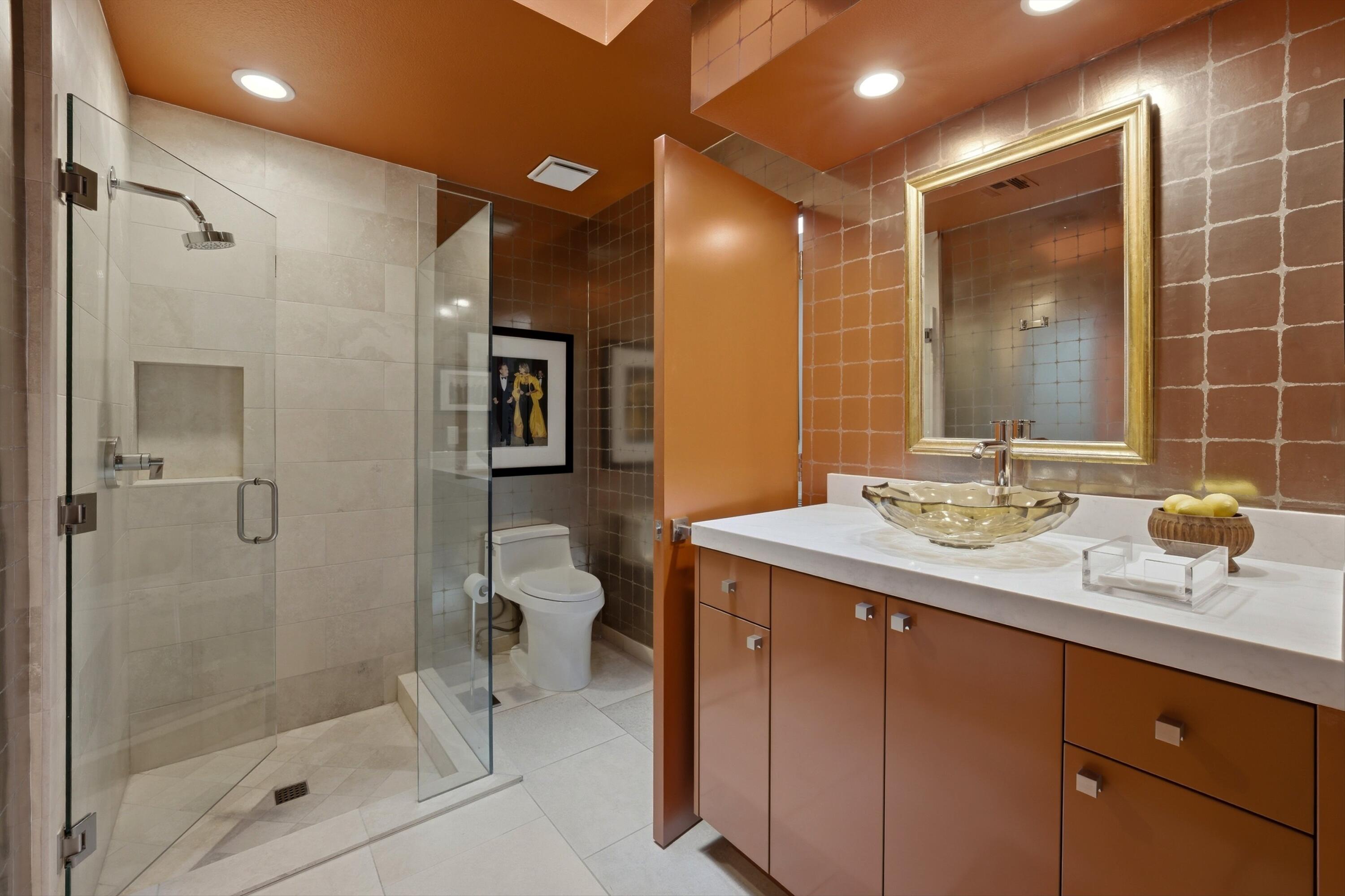 3 Barnard Court Rancho Mirage, CA 92270 - Photo 32 of 47 a bathroom with a shower sink and mirror