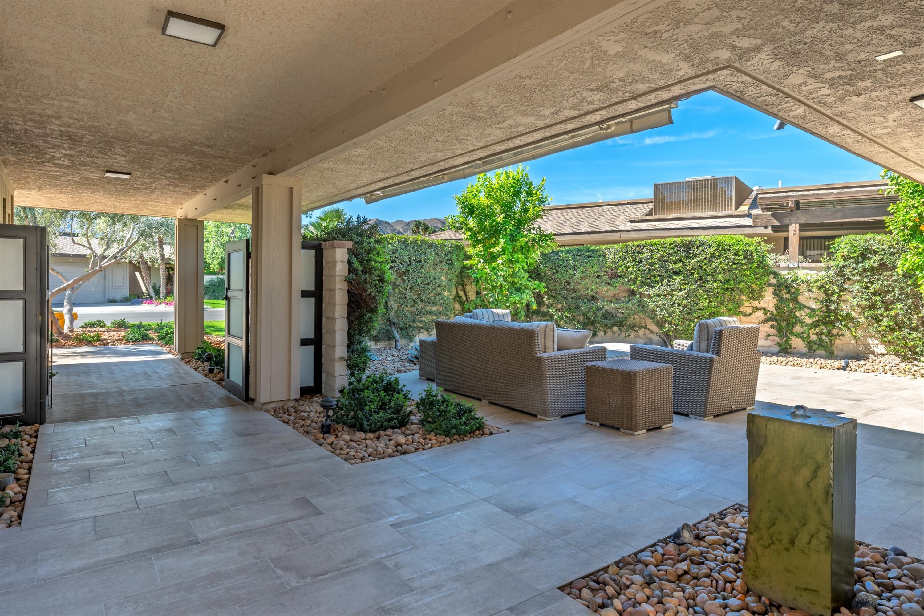 3 Barnard Court Rancho Mirage, CA 92270 - Photo 35 of 47 a view of a backyard with garden