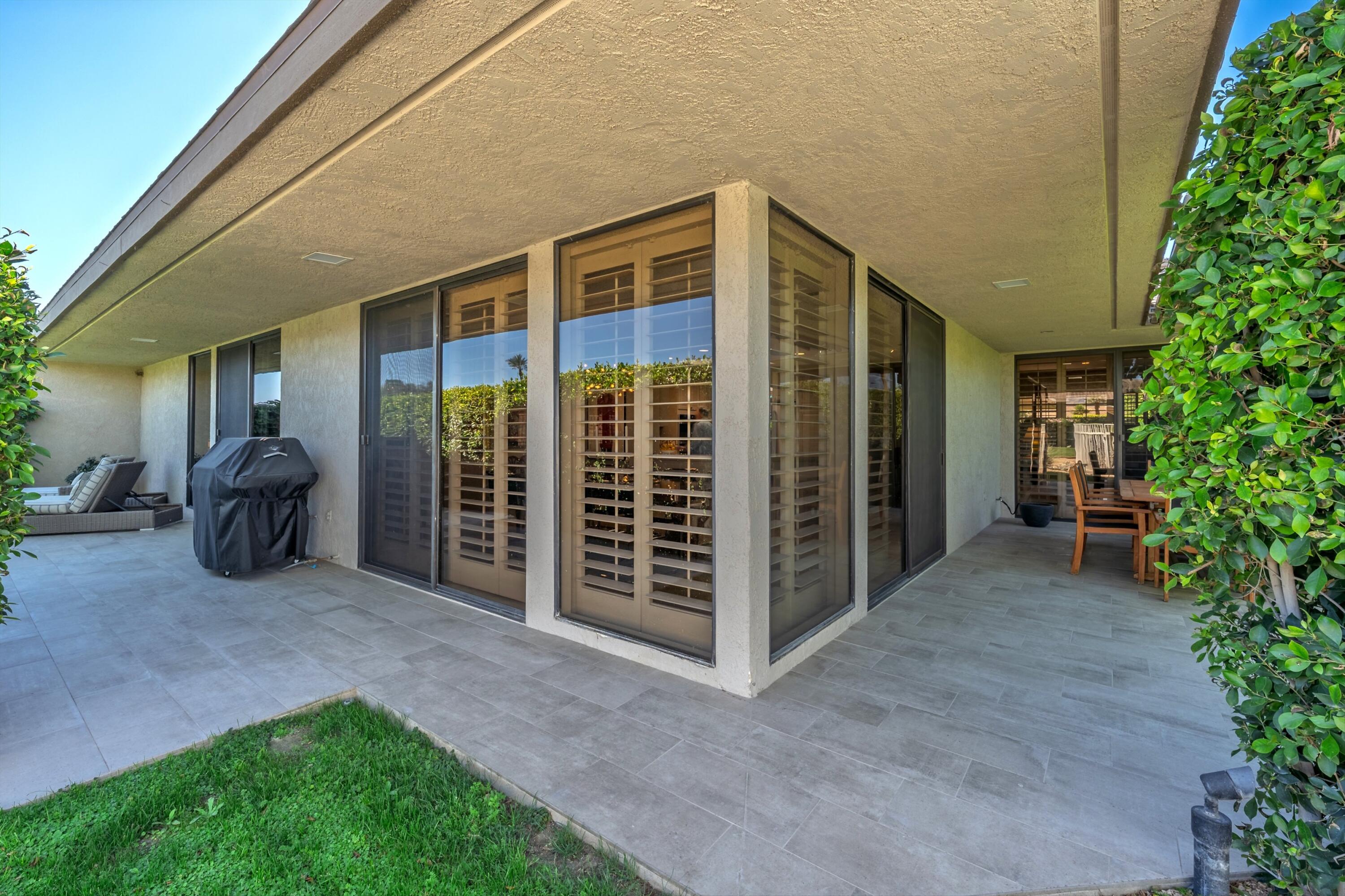 3 Barnard Court Rancho Mirage, CA 92270 - Photo 39 of 47 a view of a house with backyard and porch