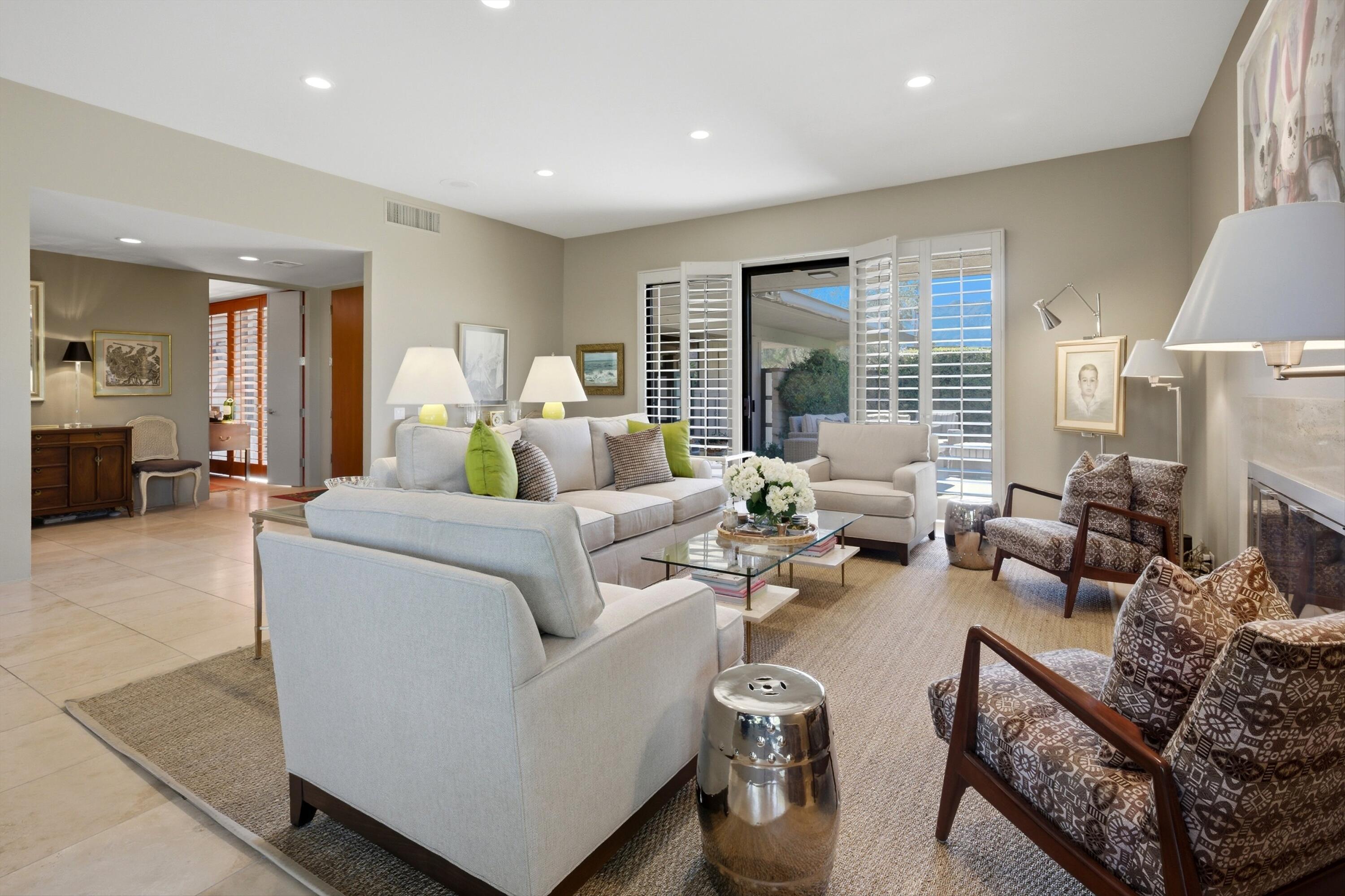 3 Barnard Court Rancho Mirage, CA 92270 - Photo 41 of 47 a living room with furniture and a large window