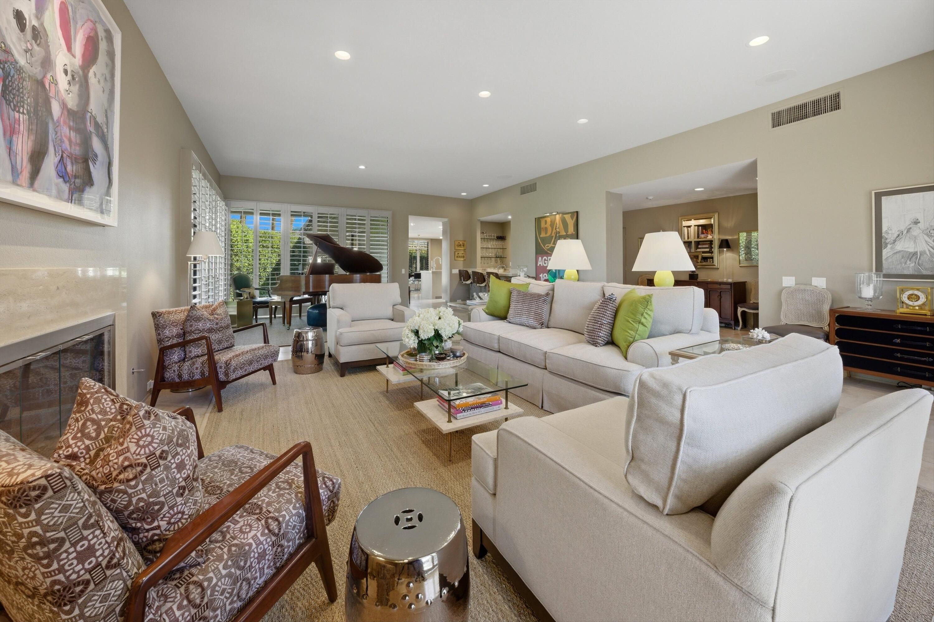3 Barnard Court Rancho Mirage, CA 92270 - Photo 42 of 47 a living room with furniture and a large window
