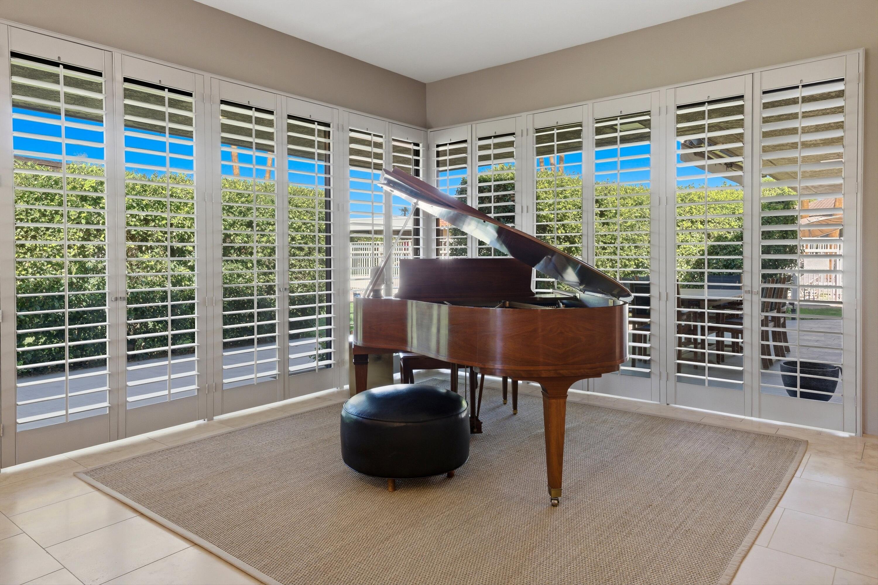 3 Barnard Court Rancho Mirage, CA 92270 - Photo 43 of 47 a living room with furniture and a window