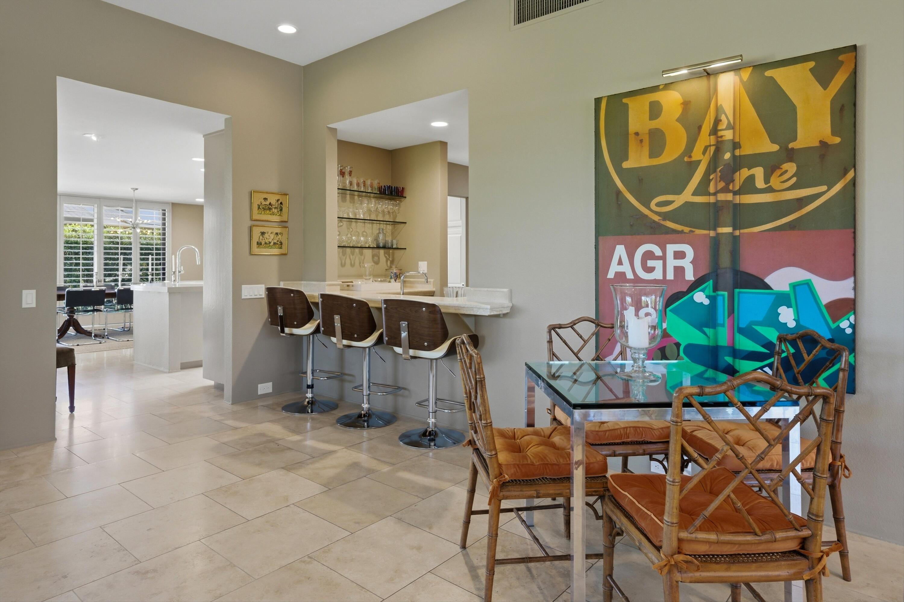 3 Barnard Court Rancho Mirage, CA 92270 - Photo 9 of 47 a dining room with furniture and wooden floor