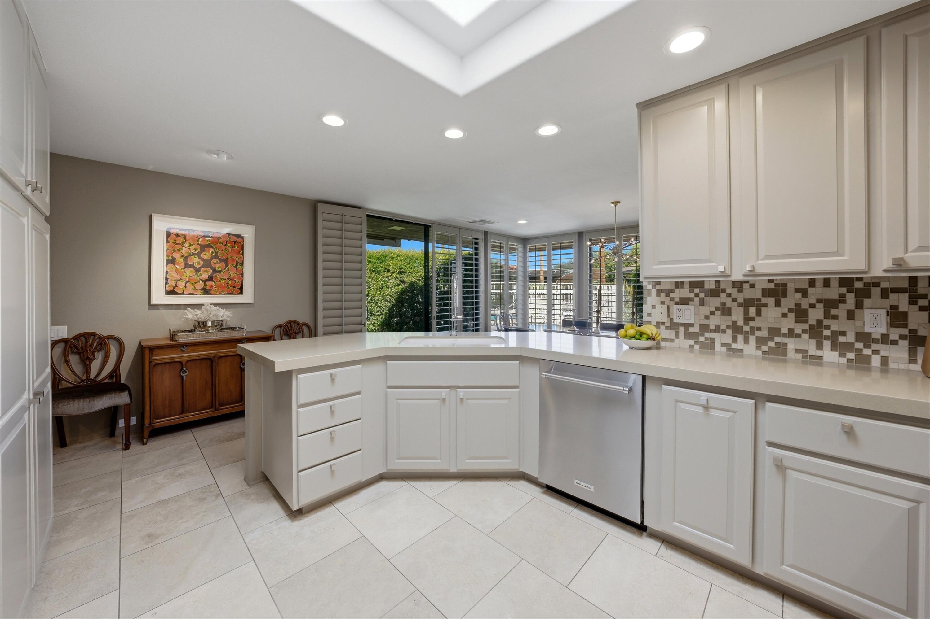 3 Barnard Court Rancho Mirage, CA 92270 - Photo 10 of 47 a kitchen with sink cabinets and window