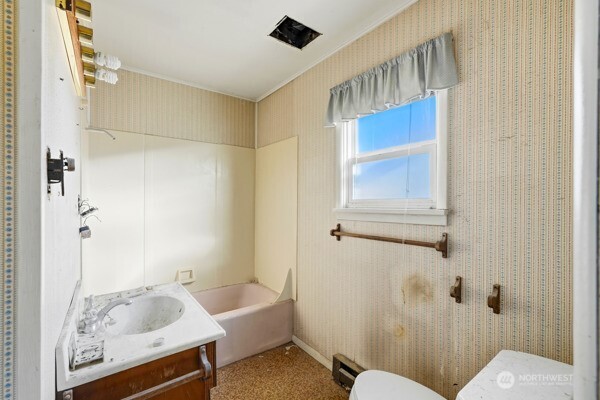 2009 Lombard Avenue Everett, WA 98201 - Photo 12 of 26 a bathroom with a sink a toilet and shower