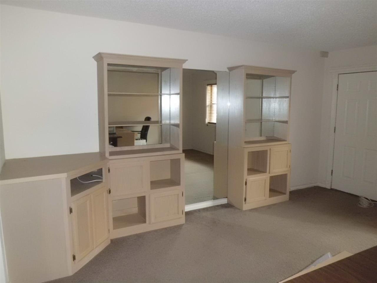 8915 McPherson Road, Unit 31D Laredo, TX 78045 - Photo 2 of 9 a view of a hallway with wooden floor and cabinet