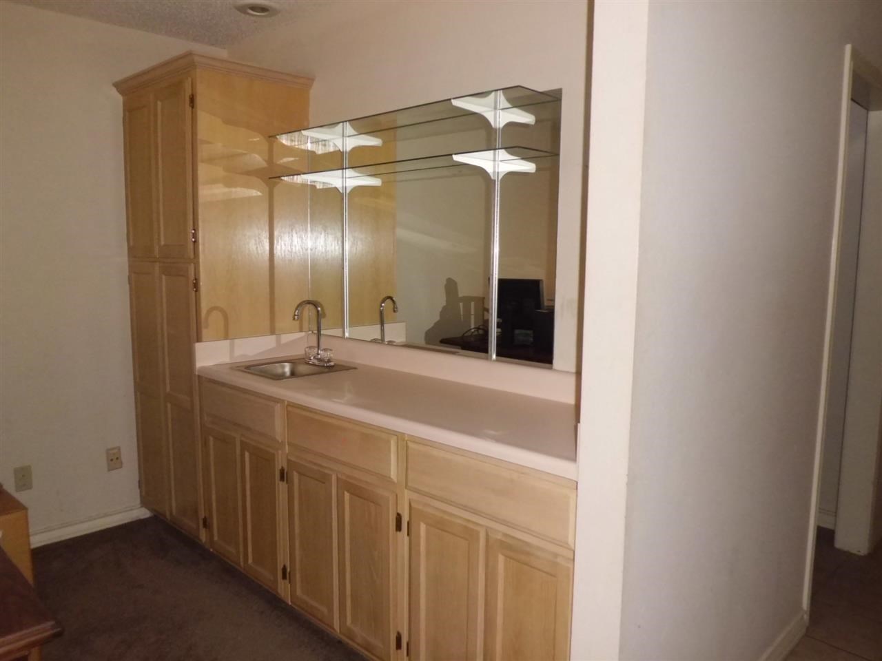 8915 McPherson Road, Unit 31D Laredo, TX 78045 - Photo 3 of 9 a bathroom with a double vanity sink and a mirror