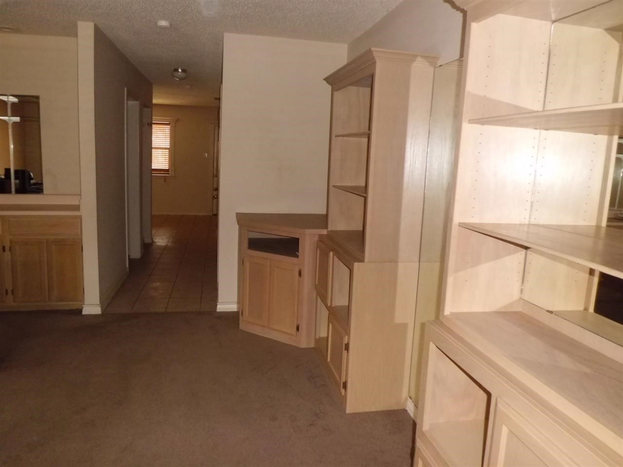 8915 McPherson Road, Unit 31D Laredo, TX 78045 - Photo 7 of 9 a view of empty room with wooden floor and cabinet