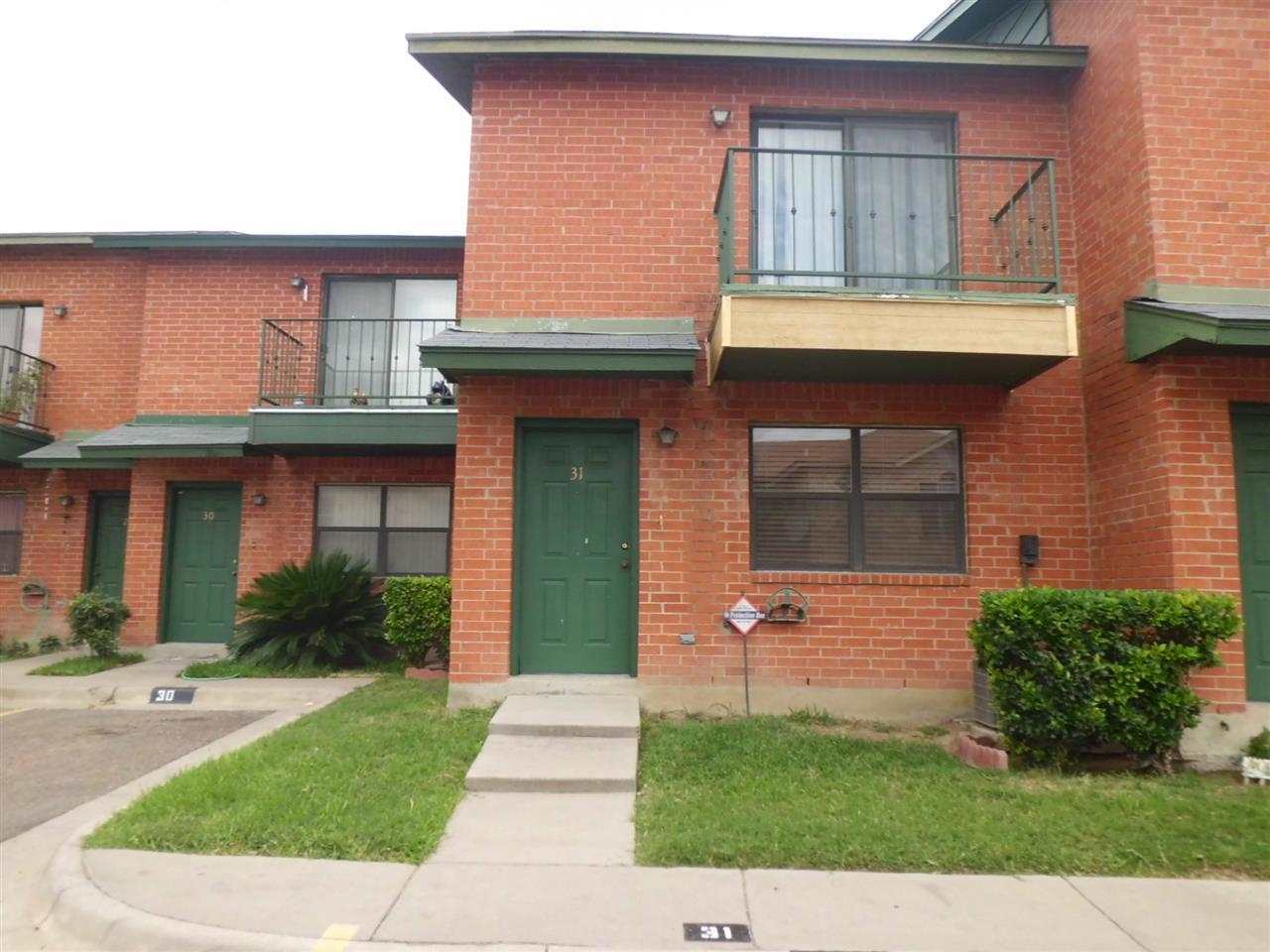8915 McPherson Road, Unit 31D Laredo, TX 78045 - Photo 9 of 9 a front view of a house with garden