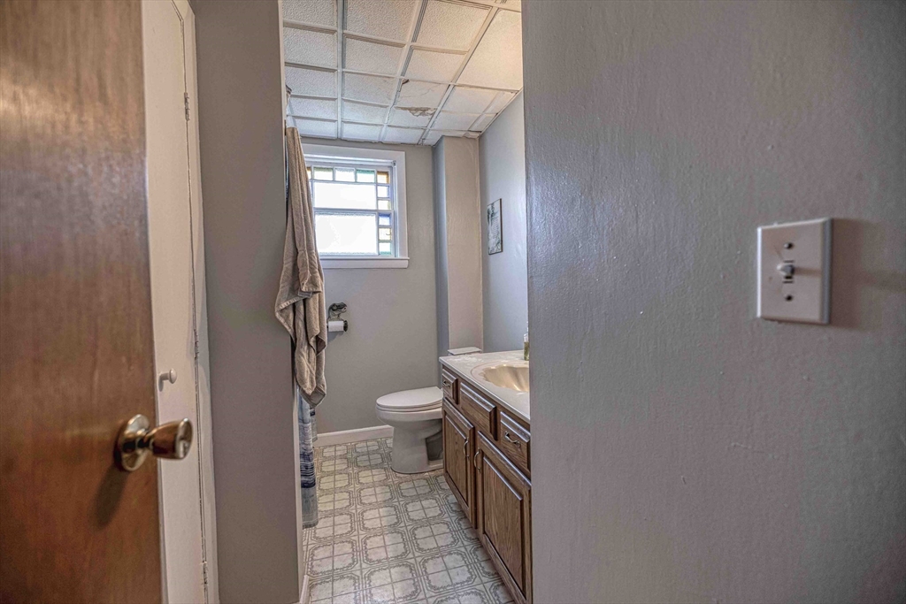 60 Murray Street Fall River, MA 02720 - Photo 16 of 35 a bathroom with a toilet a sink and shower
