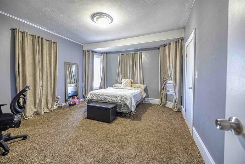 60 Murray Street Fall River, MA 02720 - Photo 22 of 35 a bedroom with a bed couch and a window