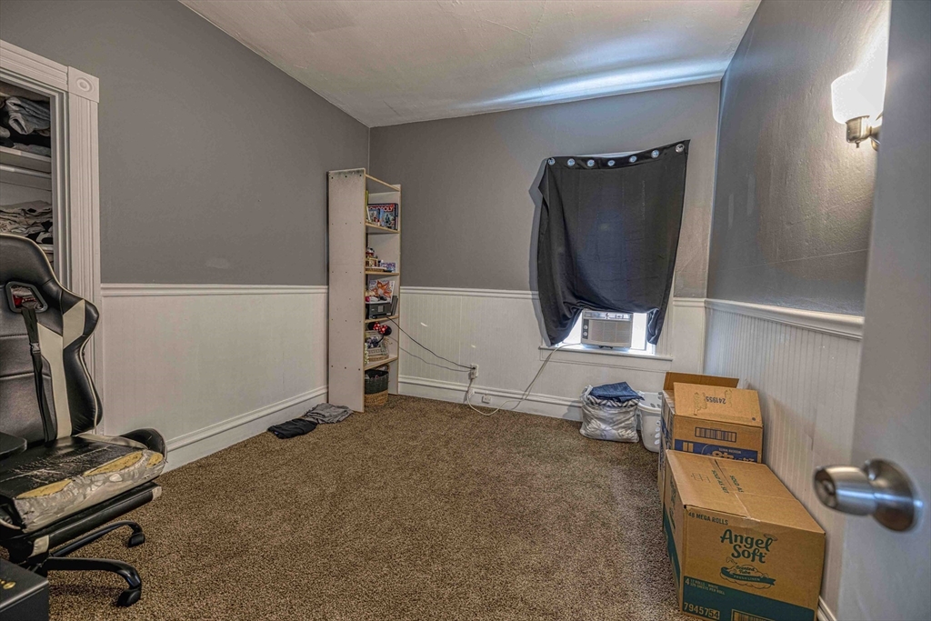 60 Murray Street Fall River, MA 02720 - Photo 24 of 35 a room with gym equipment and a flat screen tv