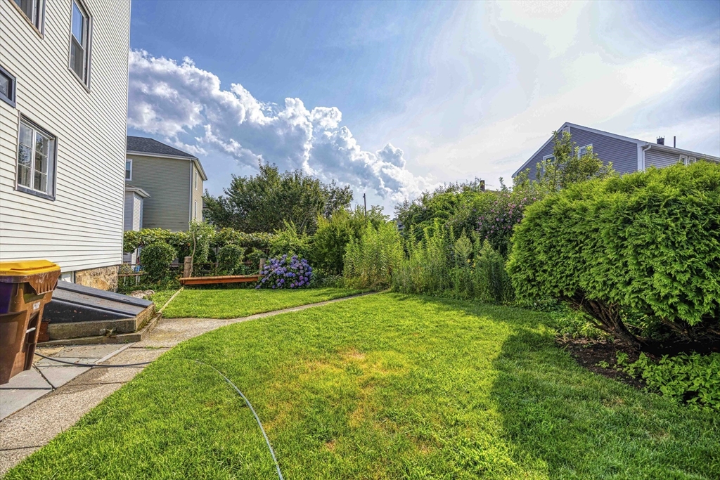 60 Murray Street Fall River, MA 02720 - Photo 26 of 35 a view of a backyard with plants and a garden