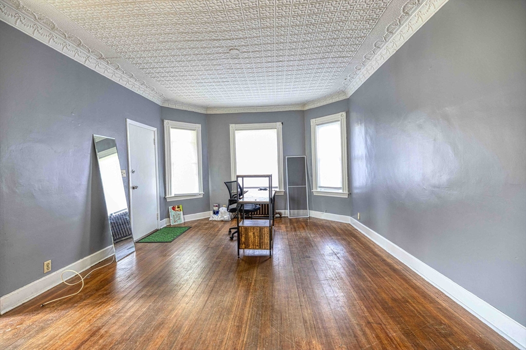 60 Murray Street Fall River, MA 02720 - Photo 4 of 35 a living room with furniture and a wooden floor