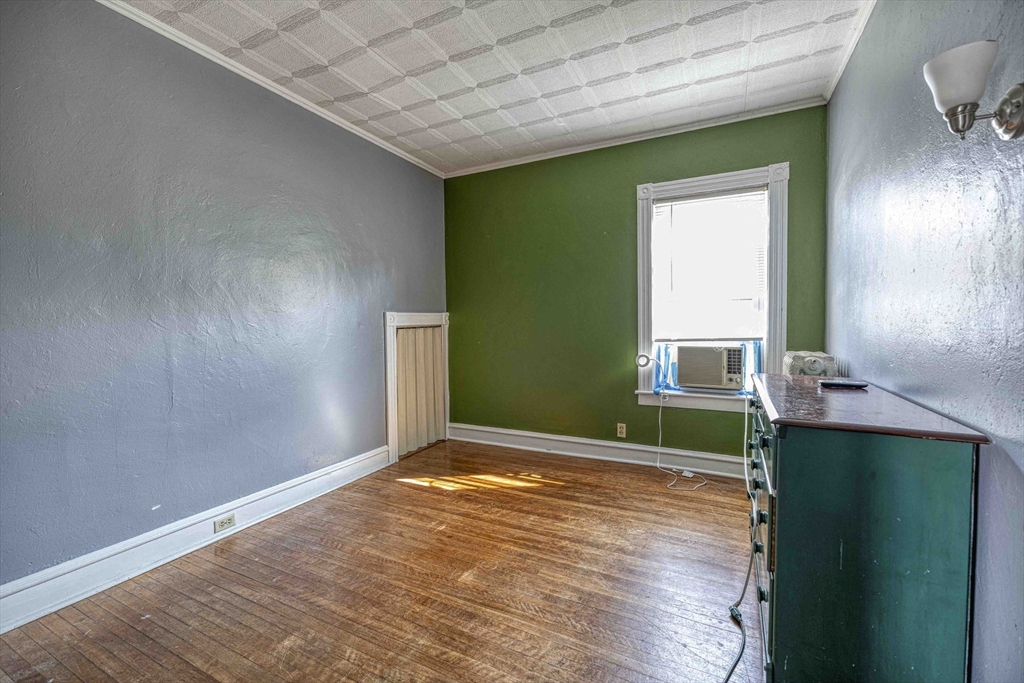 60 Murray Street Fall River, MA 02720 - Photo 6 of 35 a view of an empty room with window and wooden floor
