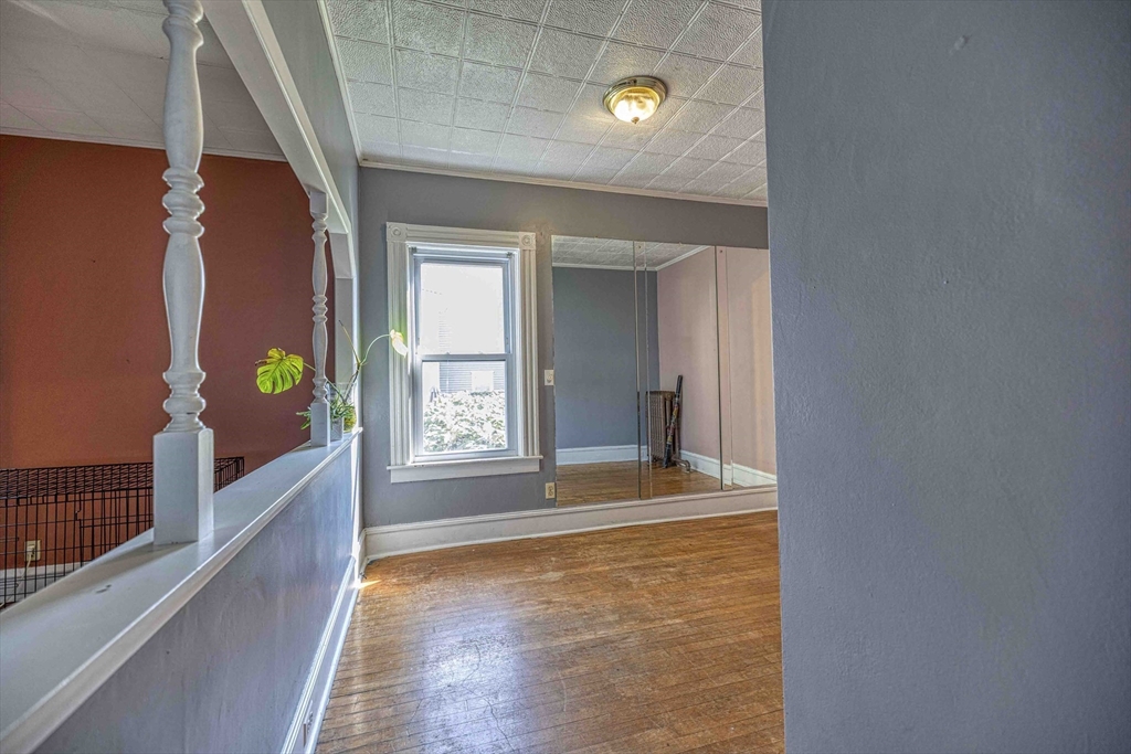60 Murray Street Fall River, MA 02720 - Photo 7 of 35 a view of an empty room with window and wooden floor