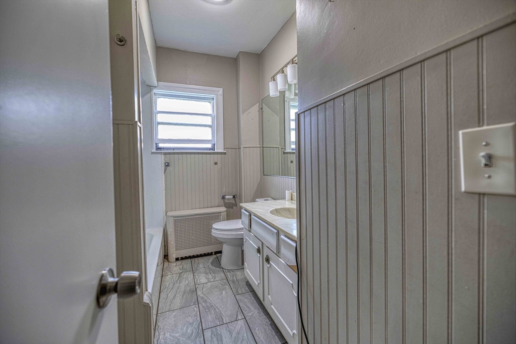 60 Murray Street Fall River, MA 02720 - Photo 8 of 35 a bathroom with a toilet a sink and bath tub