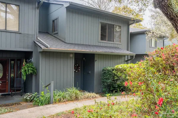a kitchen with a stove a sink and a microwave