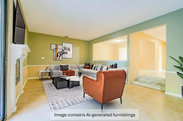 a living room with furniture wooden floor and a large window