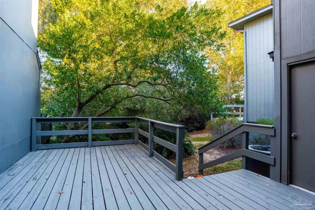 a view of deck with wooden floor and fence