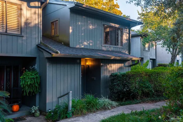 a view of house with backyard space and garden