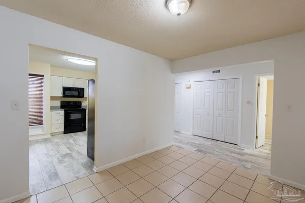 a front view of a house with plants