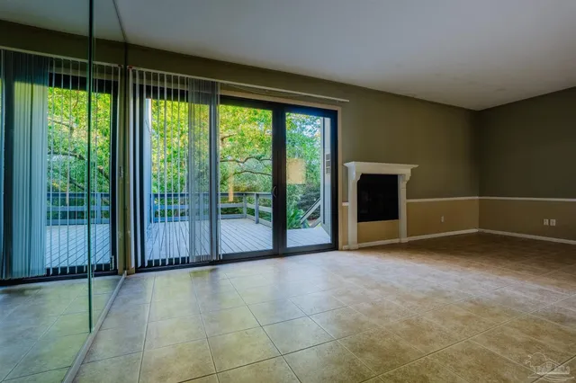 a view of a room with sliding glass door and mountain view