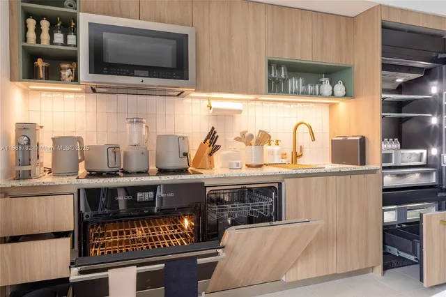 a view of a storage and utility room with washer and dryer