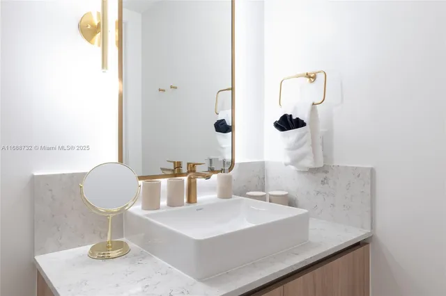 a dining room with furniture and a floor to ceiling window