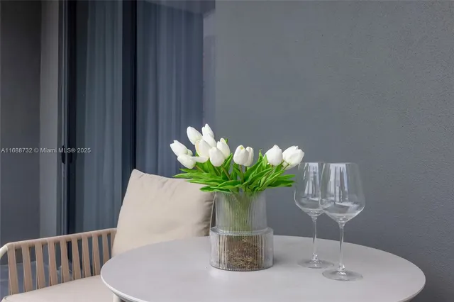 a spacious bathroom with a sink a toilet a mirror and shower