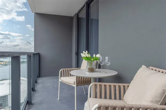 a bedroom with a bed and a chair