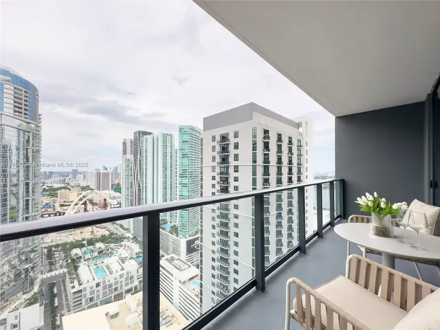 a bedroom with a bed and a chair