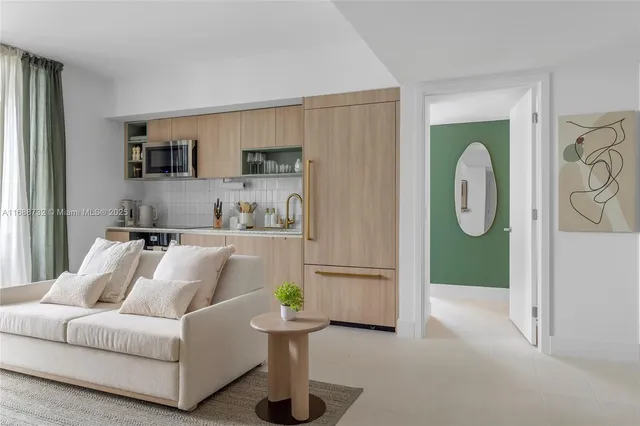 a bedroom with a bed a potted plant and a window