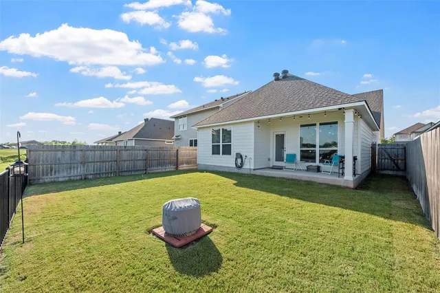 a bedroom with a bed and a book shelf