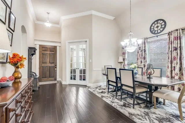 a view of a room with furniture and wooden floor