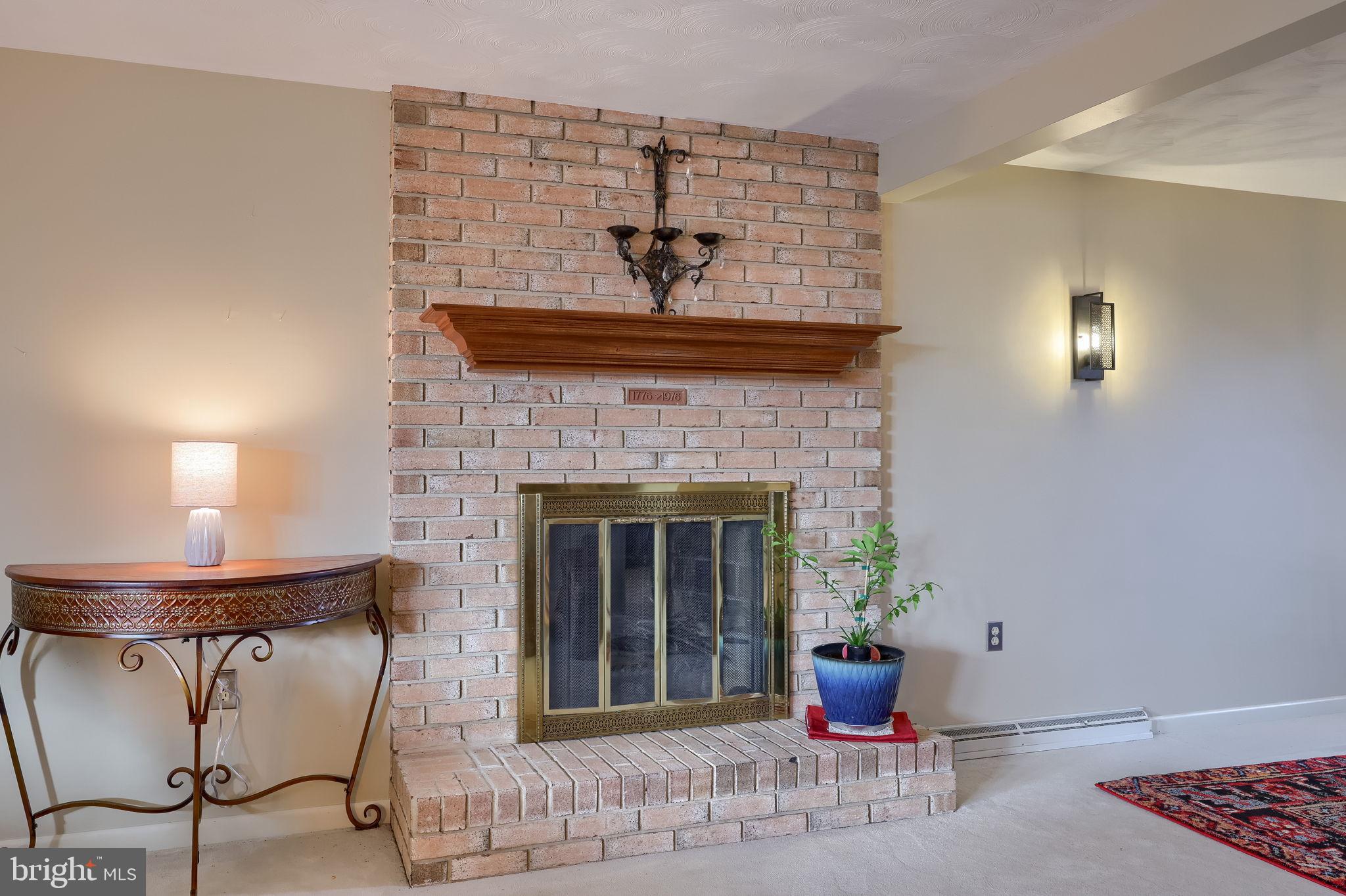 3161 Starlight Drive York, PA 17402 - Photo 17 of 51 Cozy brick fireplace with elegant accents.