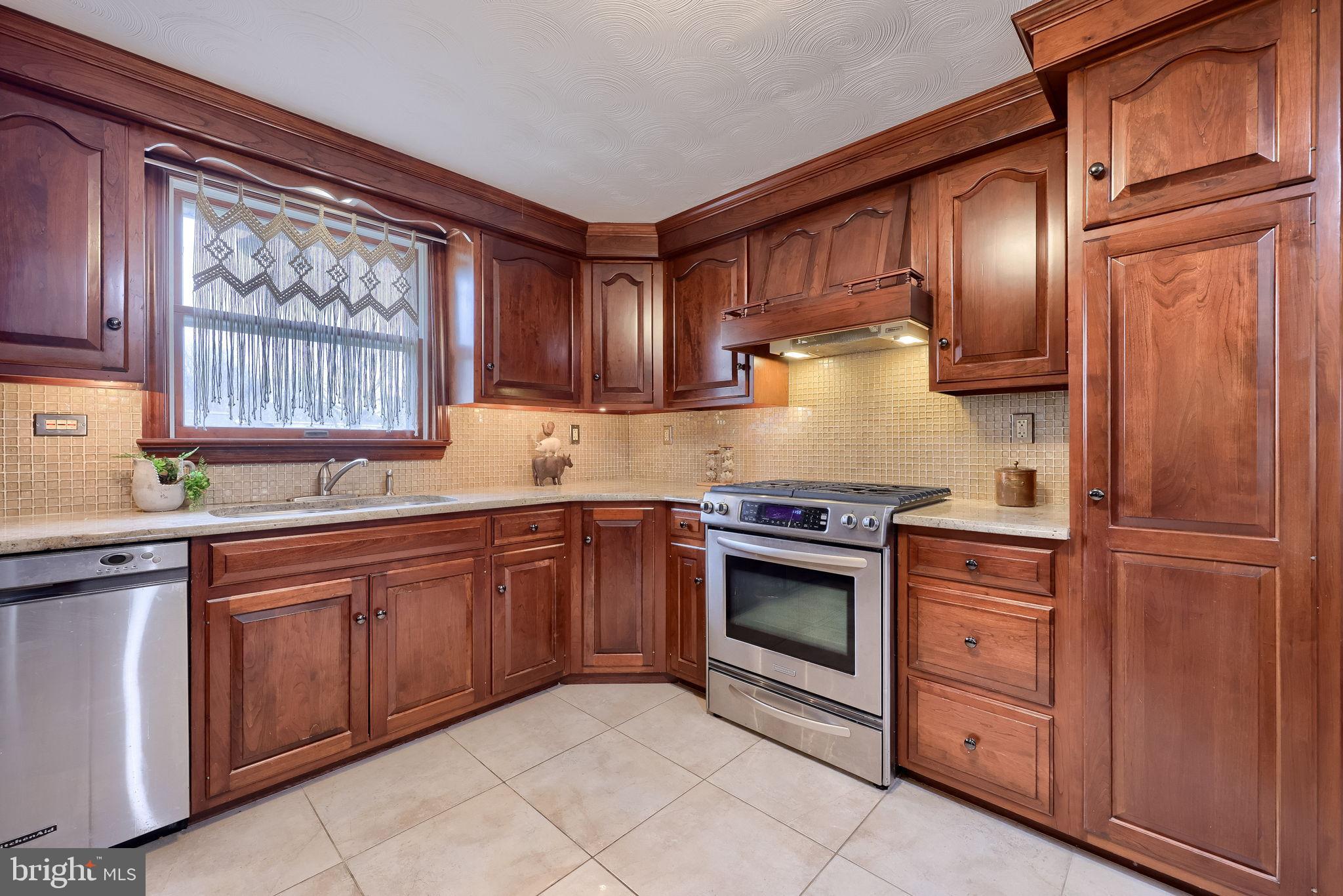 3161 Starlight Drive York, PA 17402 - Photo 21 of 51 Warm wooden kitchen with modern appliances.