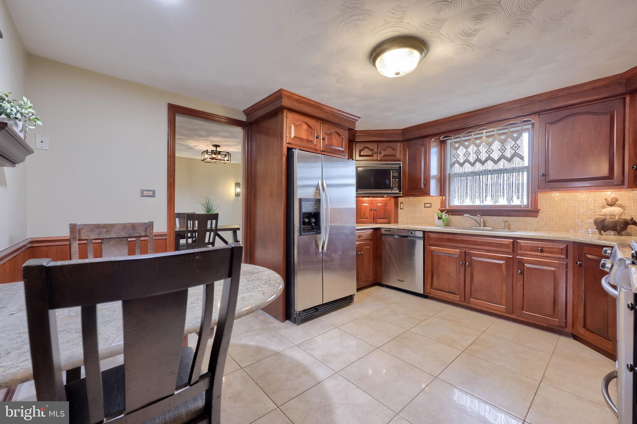 3161 Starlight Drive York, PA 17402 - Photo 22 of 51 Warm and inviting kitchen with rich wood tones.