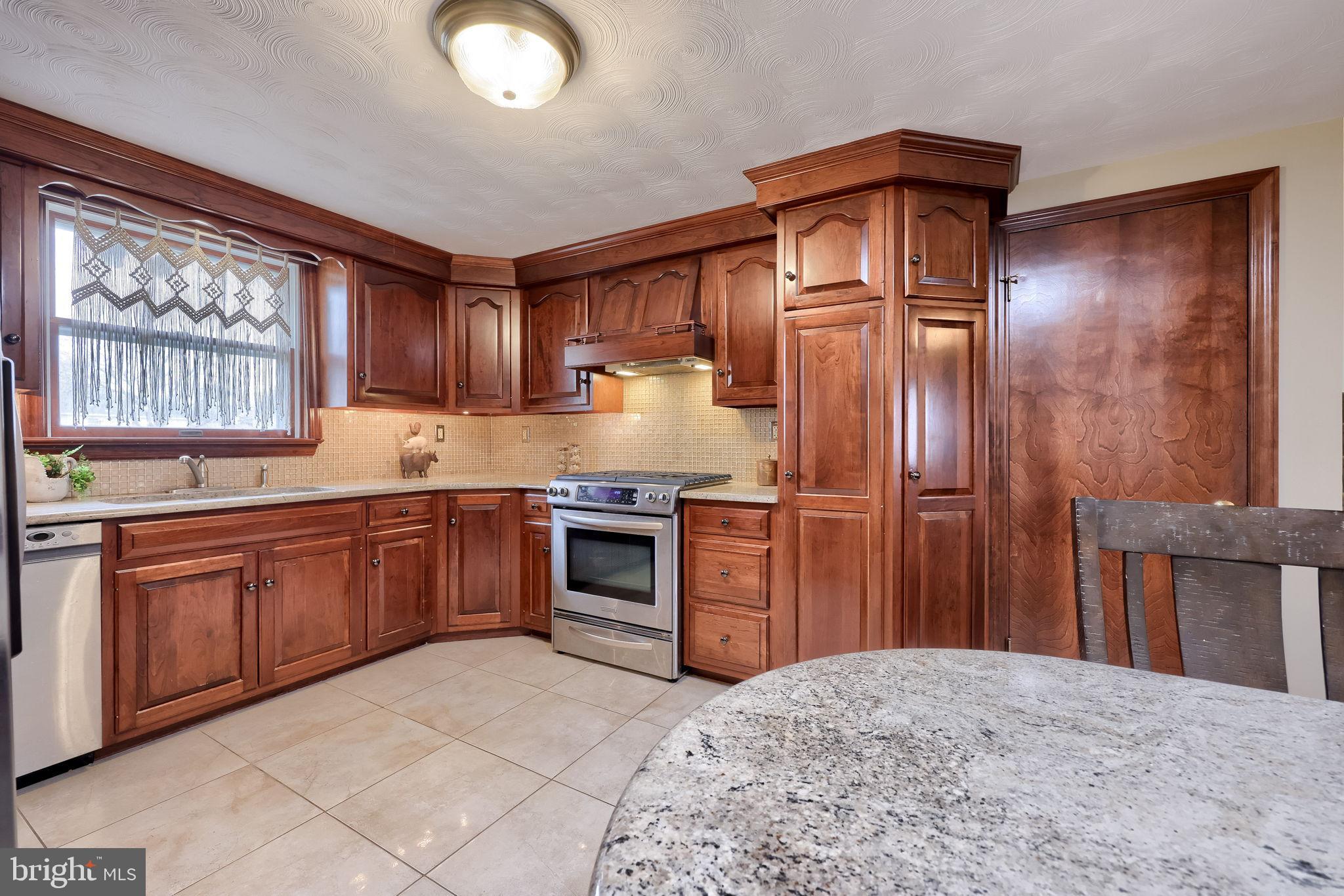 3161 Starlight Drive York, PA 17402 - Photo 25 of 51 Warm wood tones in a cozy kitchen space.