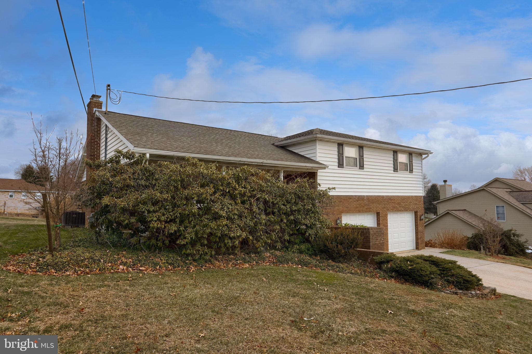 3161 Starlight Drive York, PA 17402 - Photo 4 of 51 Charming split-level home with lush greenery.
