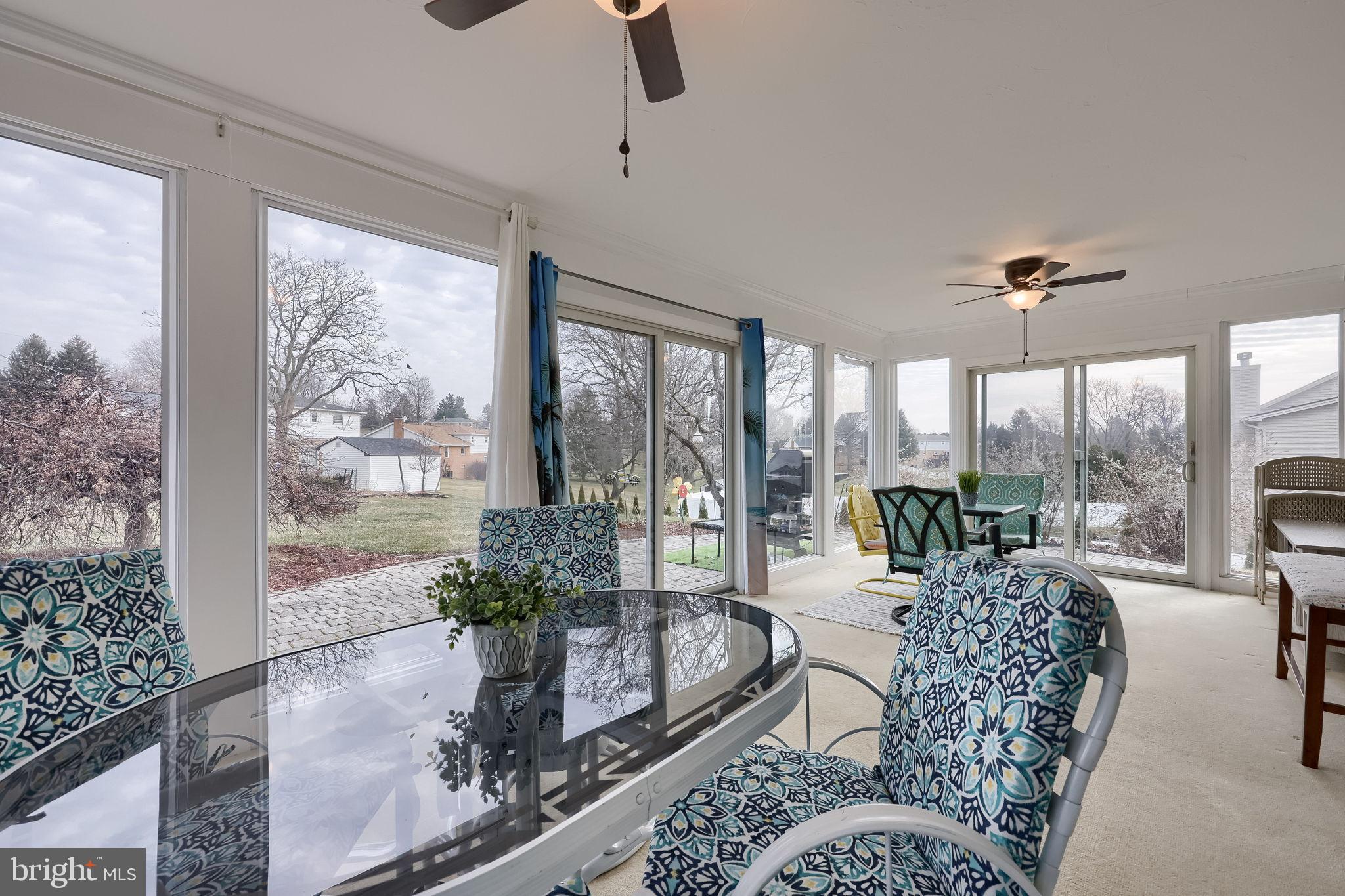 3161 Starlight Drive York, PA 17402 - Photo 42 of 51 Bright sunroom with scenic outdoor views.