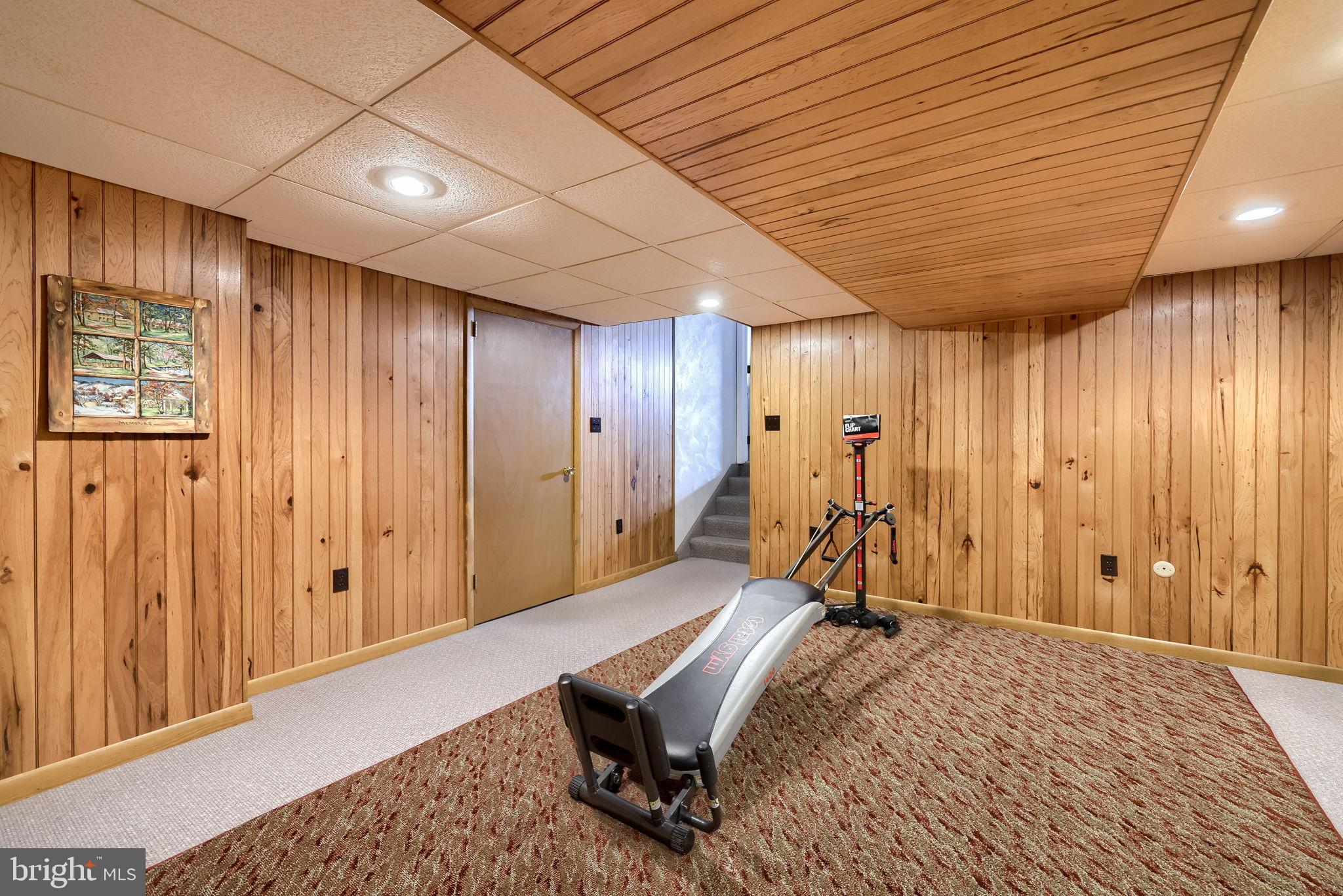 3161 Starlight Drive York, PA 17402 - Photo 44 of 51 Cozy basement retreat with wooden accents.