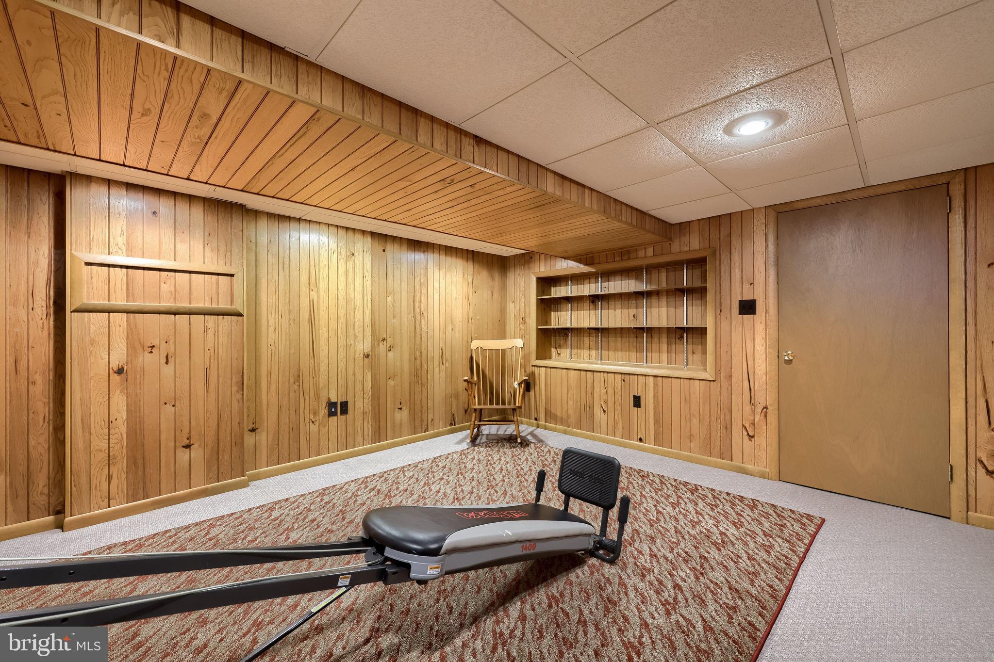 3161 Starlight Drive York, PA 17402 - Photo 45 of 51 Cozy basement retreat with wooden accents.